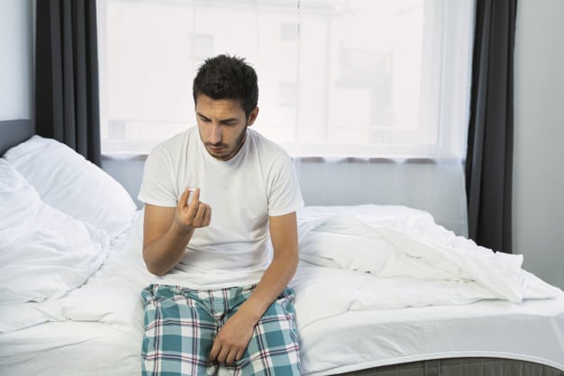 young man is sitting his bed he suffers from problems related potency 122525 847